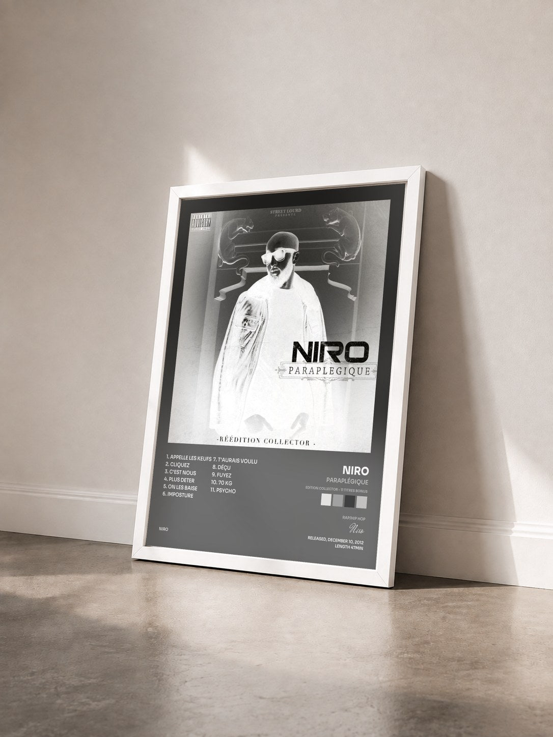 #blanc Tableau de l'album Paraplégique (Edition Collector - 11 titres Bonus) de Niro vu de trois quarts, cadre blanc