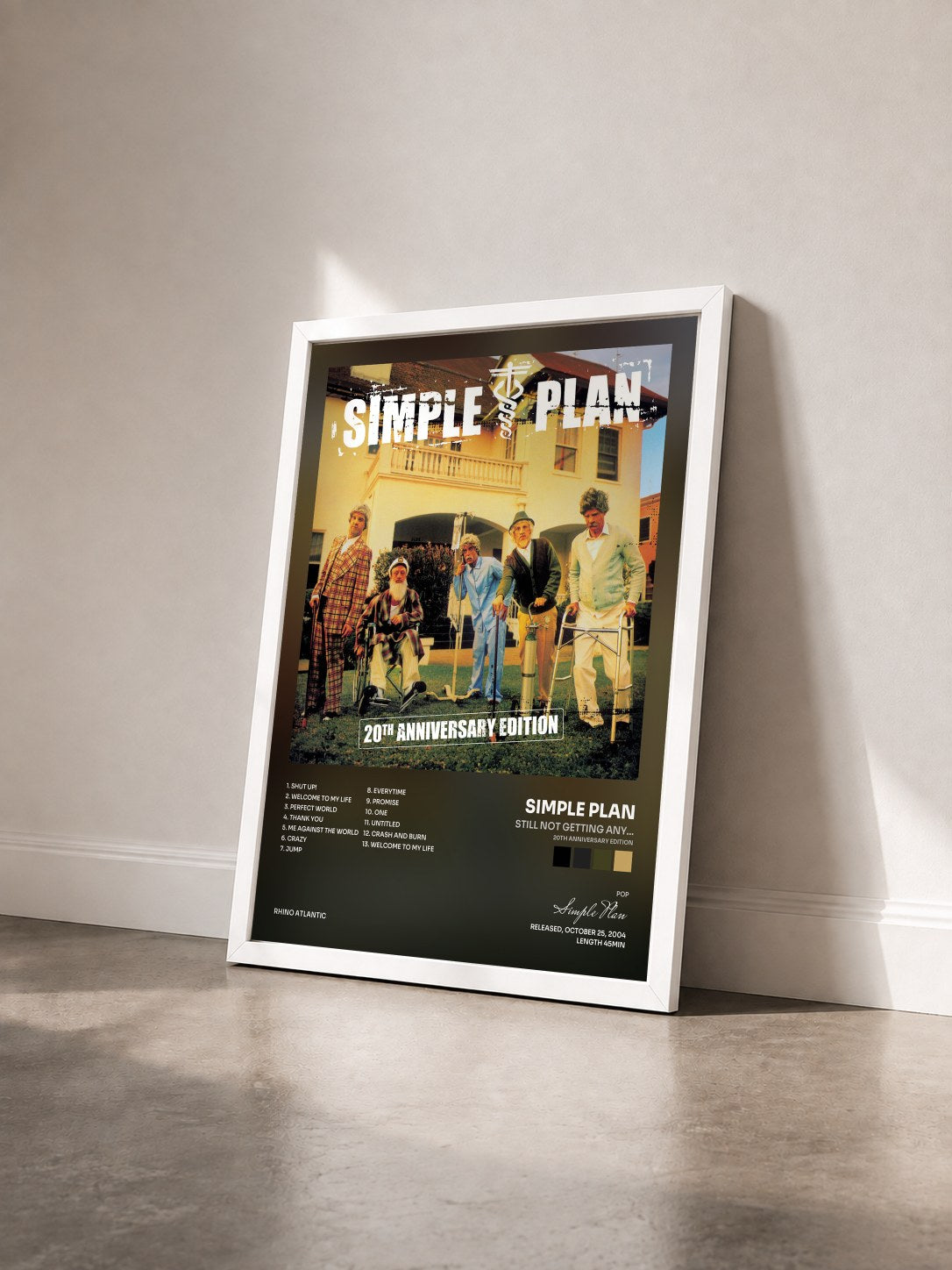 #blanc Tableau de l'album Still Not Getting Any... (20th Anniversary Edition) de Simple Plan vu de trois quarts, cadre blanc