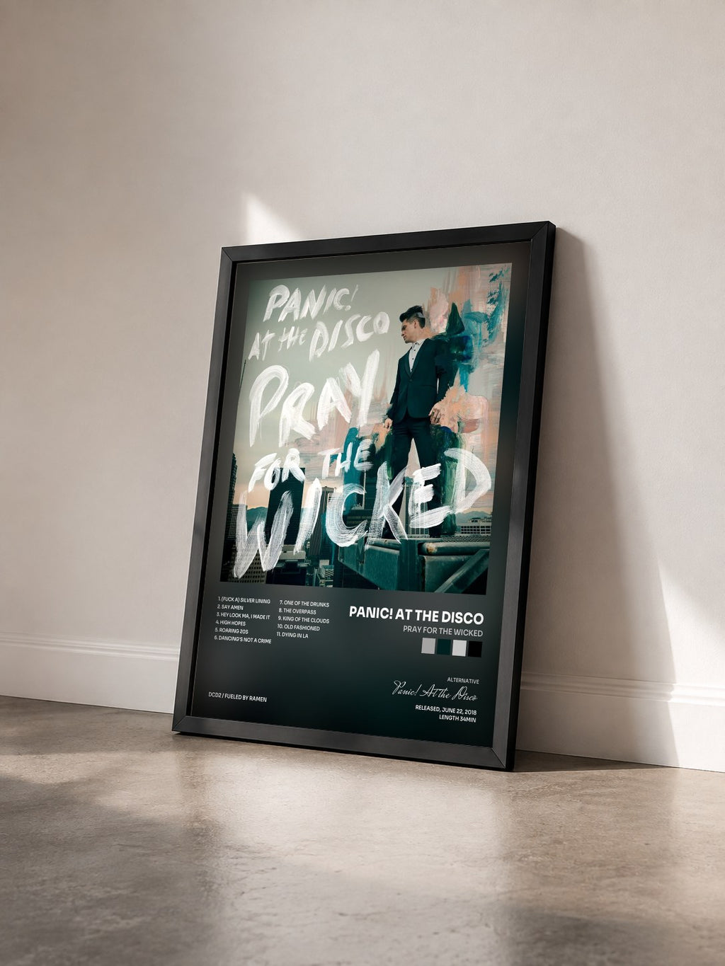 #noir Tableau de l'album Pray for the Wicked de Panic! At the Disco vu de trois quarts, cadre noir