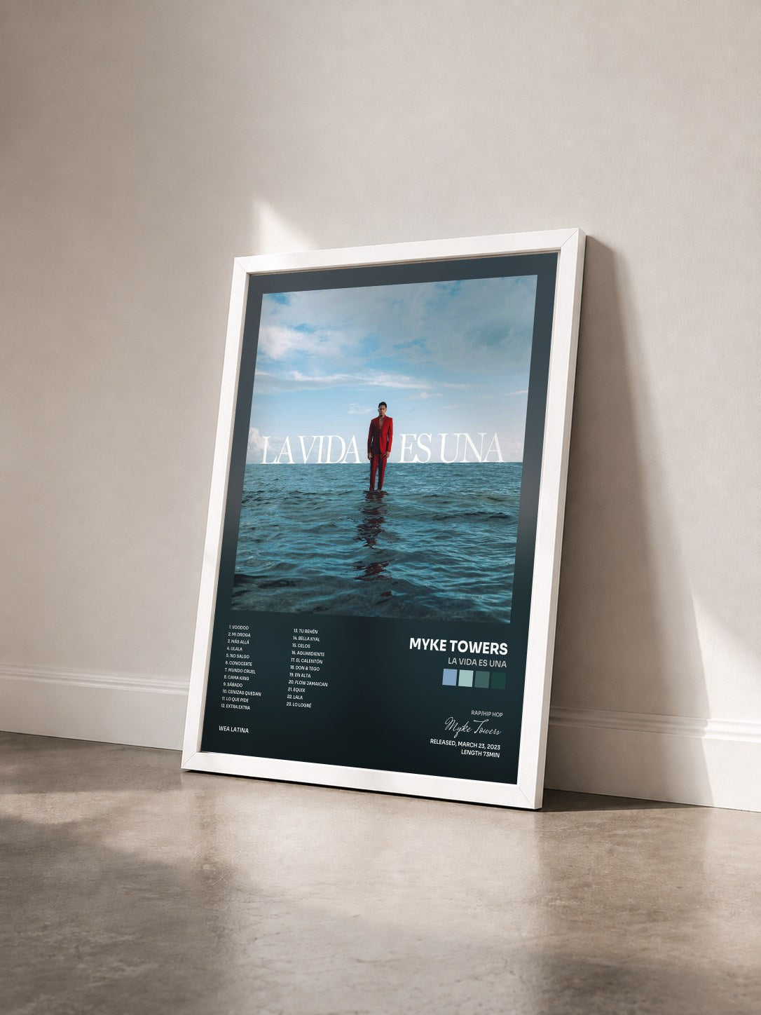 #blanc LA VIDA ES UNA by Myke Towers as a framed art print seen at an angle, white frame