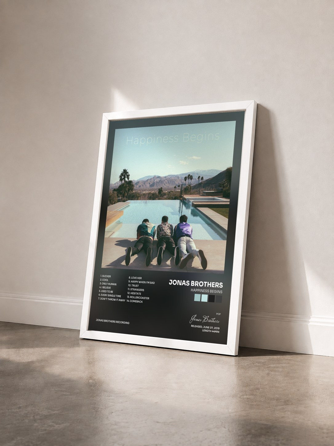 #blanc Happiness Begins di Jonas Brothers in stampa incorniciata vista di tre quarti, cornice bianca