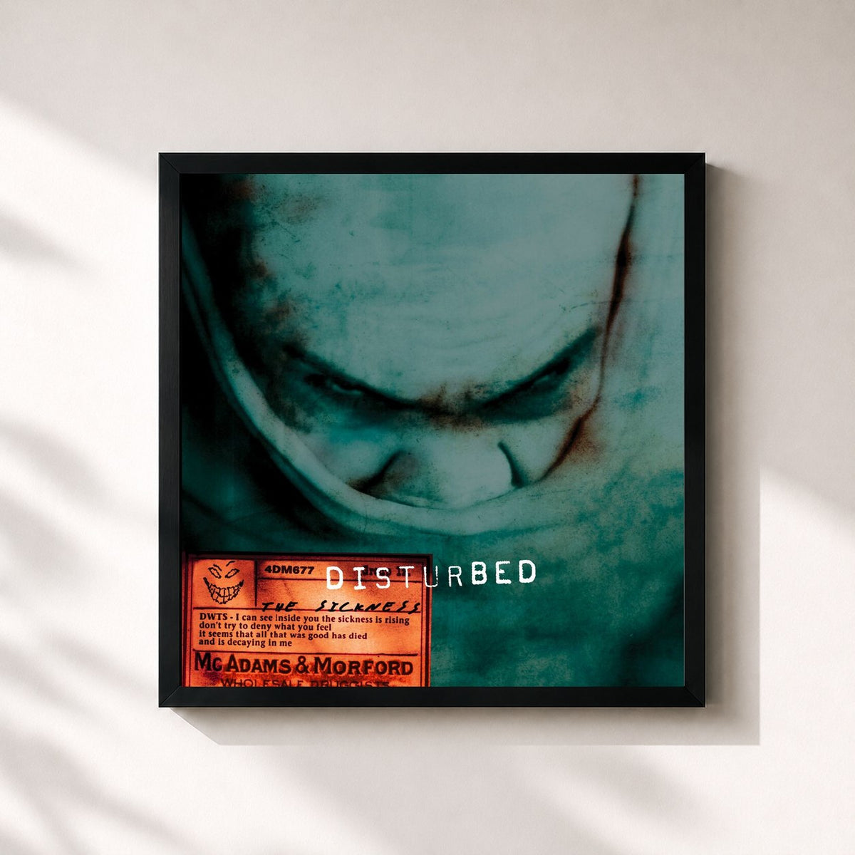 #noir The Sickness (25th Anniversary Edition) by Disturbed as a square framed art print, black 32x32 cm frame