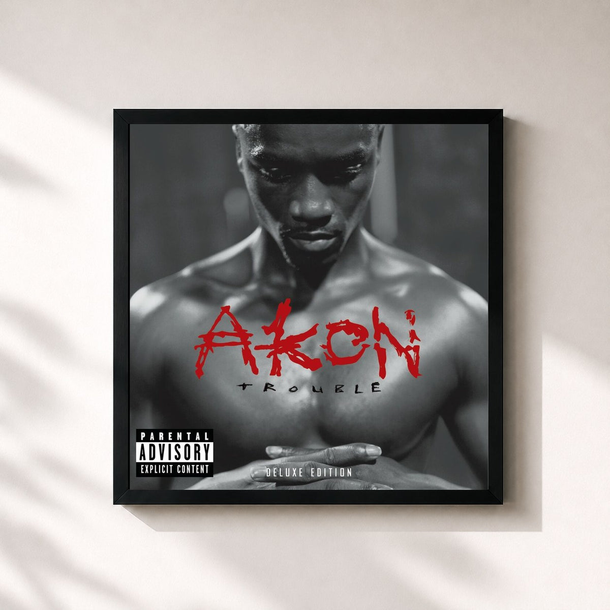 #noir Trouble Deluxe Edition by Akon as a square framed art print, black 32x32 cm frame