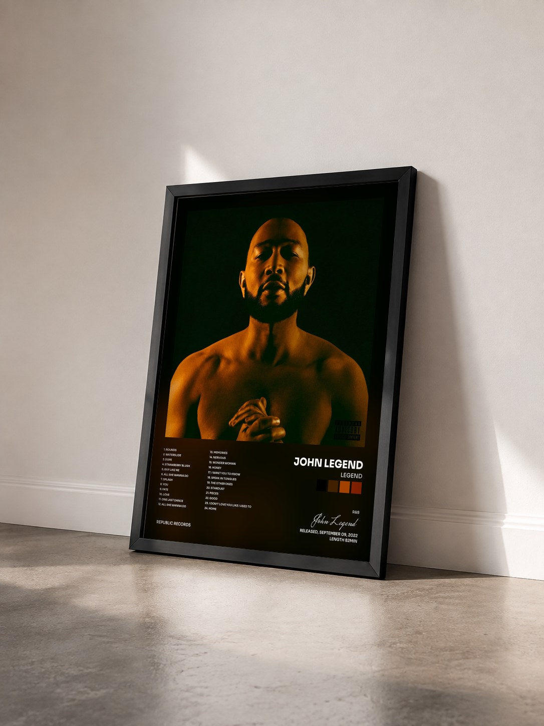 #noir Tableau de l'album LEGEND de John Legend vu de trois quarts, cadre noir