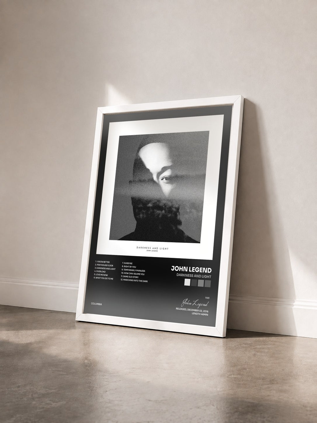 #blanc Tableau de l'album DARKNESS AND LIGHT de John Legend vu de trois quarts, cadre blanc