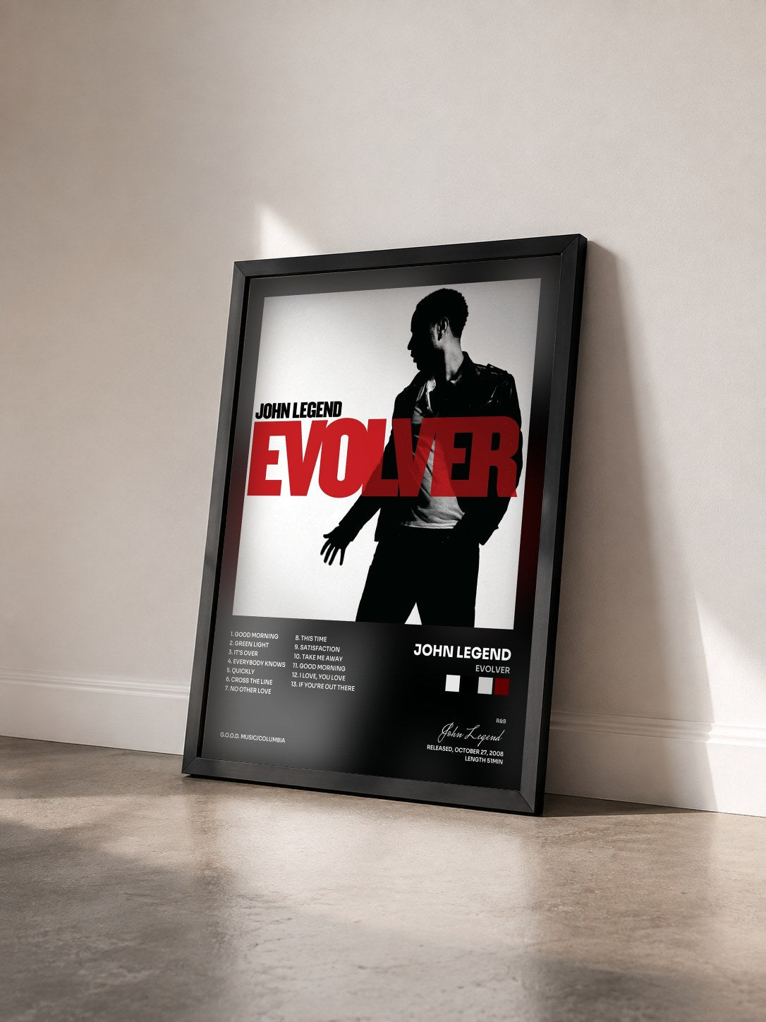 #noir Tableau de l'album Evolver de John Legend vu de trois quarts, cadre noir