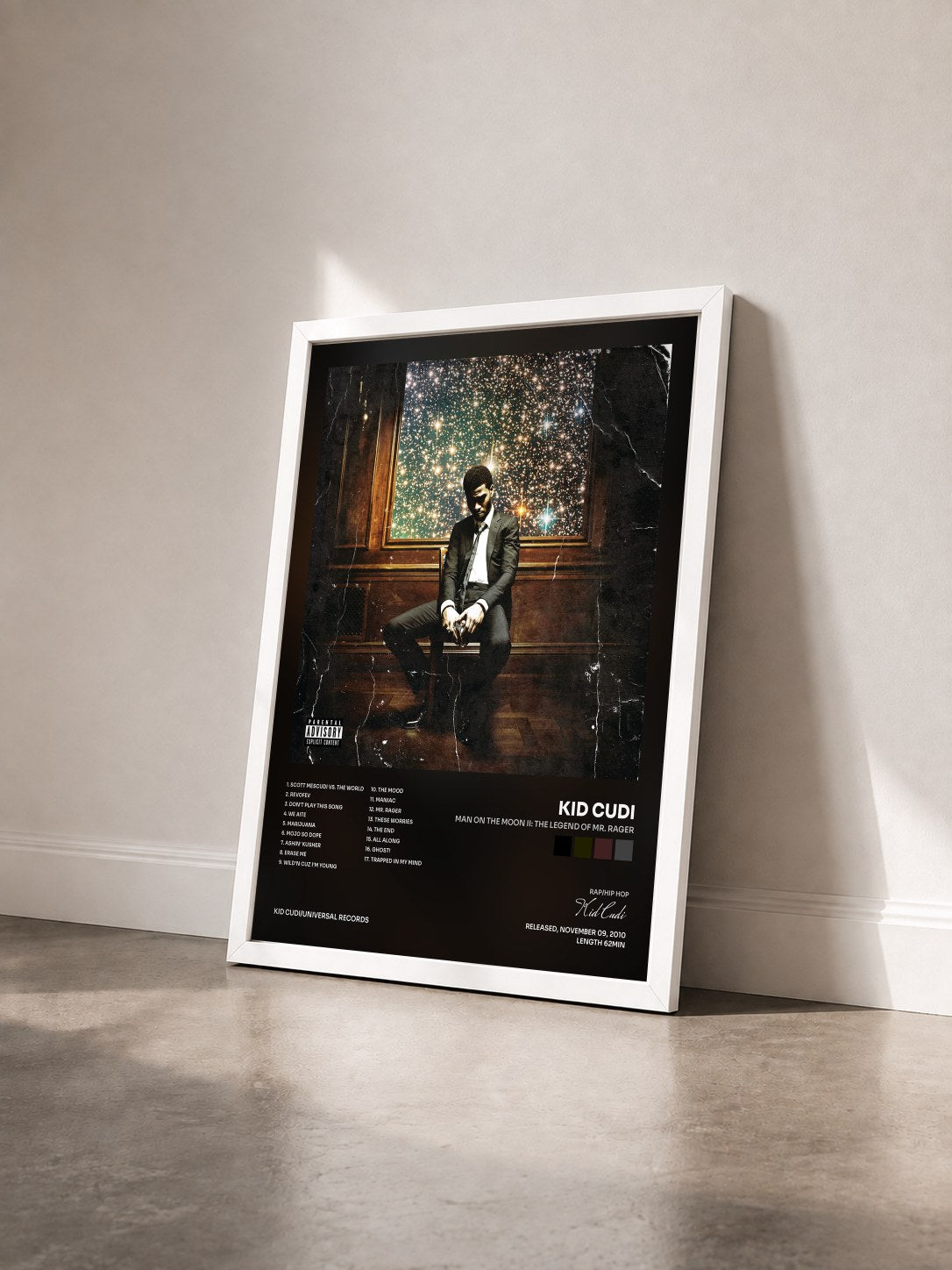 #blanc Tableau de l'album Man On The Moon II: The Legend Of Mr. Rager de Kid Cudi vu de trois quarts, cadre blanc