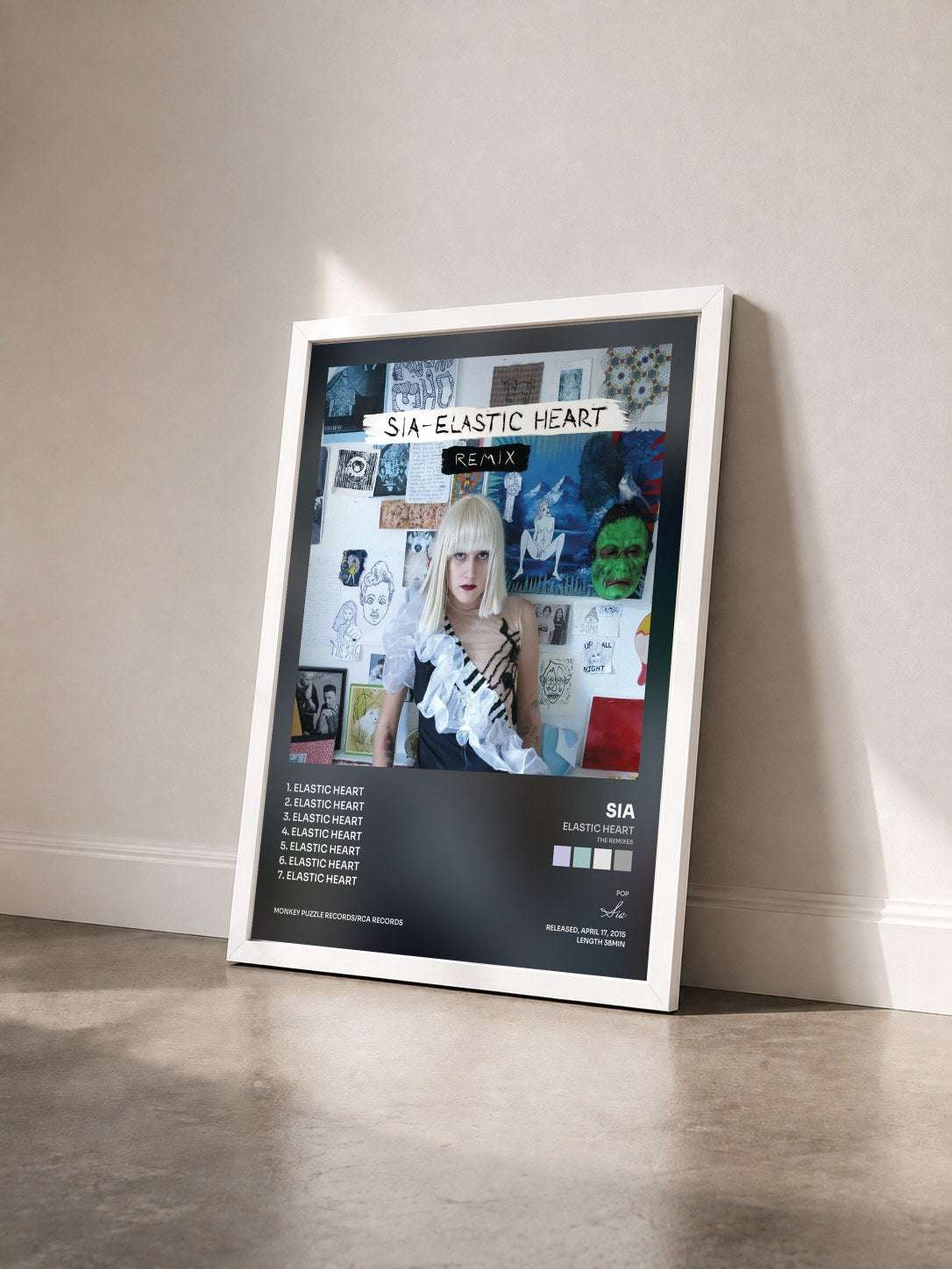 #blanc Tableau de l'album Elastic Heart (The Remixes) de Sia vu de trois quarts, cadre blanc