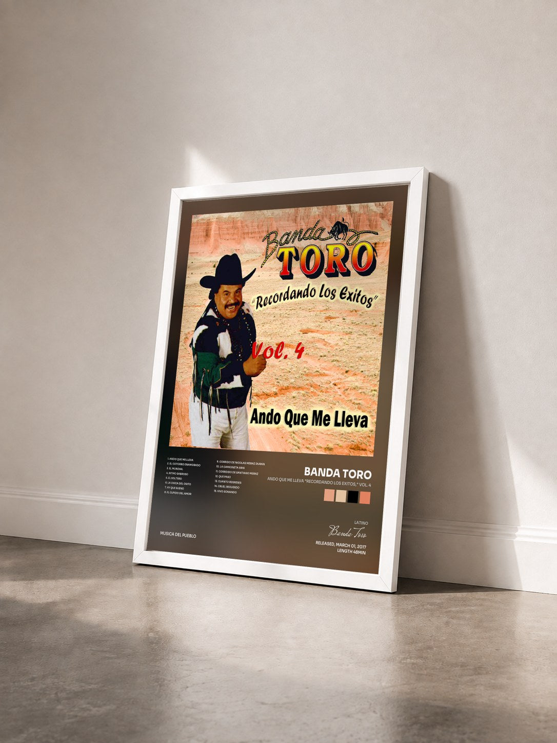 #blanc Tableau de l'album Ando Que Me Lleva "Recordando los Exitos," Vol. 4 de Banda Toro vu de trois quarts, cadre blanc