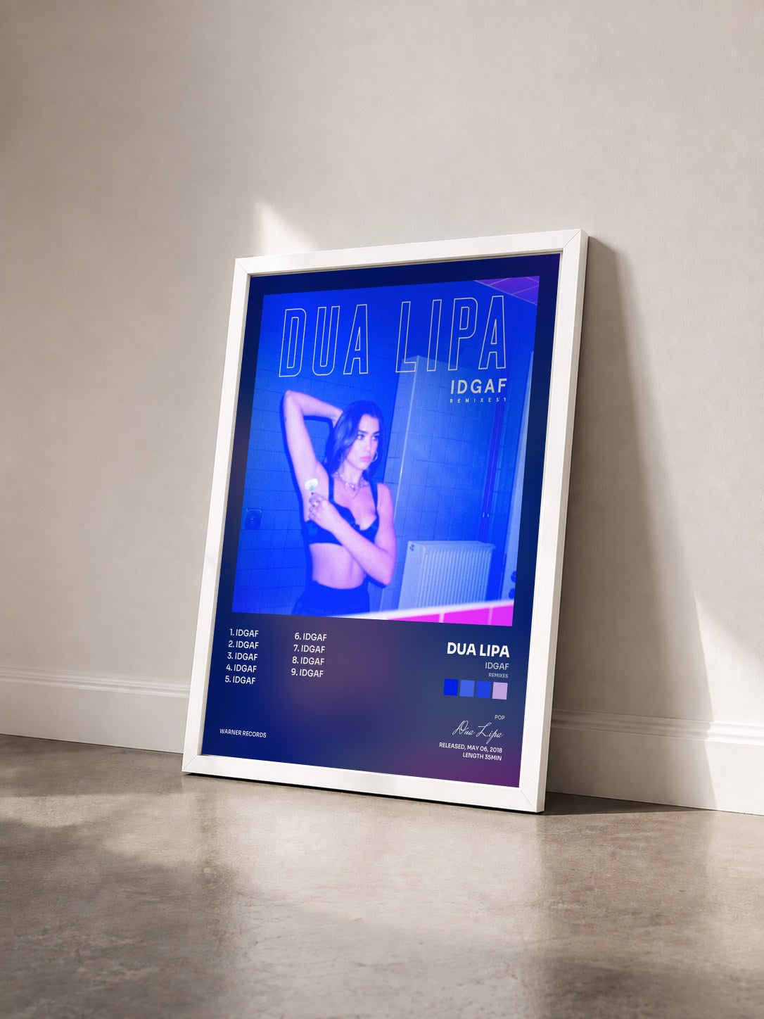 #blanc Tableau de l'album IDGAF (Remixes) de Dua Lipa vu de trois quarts, cadre blanc