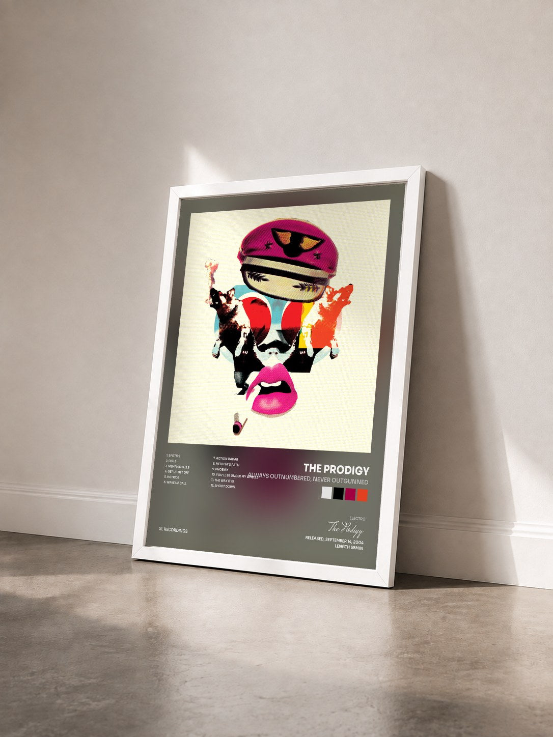 #blanc Tableau de l'album Always Outnumbered, Never Outgunned de The Prodigy vu de trois quarts, cadre blanc