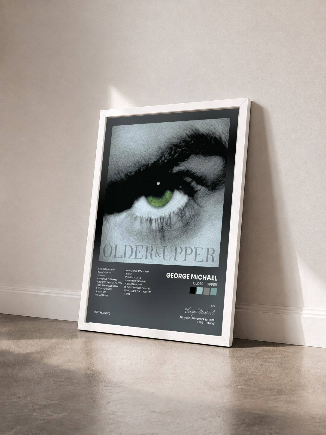 #blanc Tableau de l'album Older + Upper de George Michael vu de trois quarts, cadre blanc