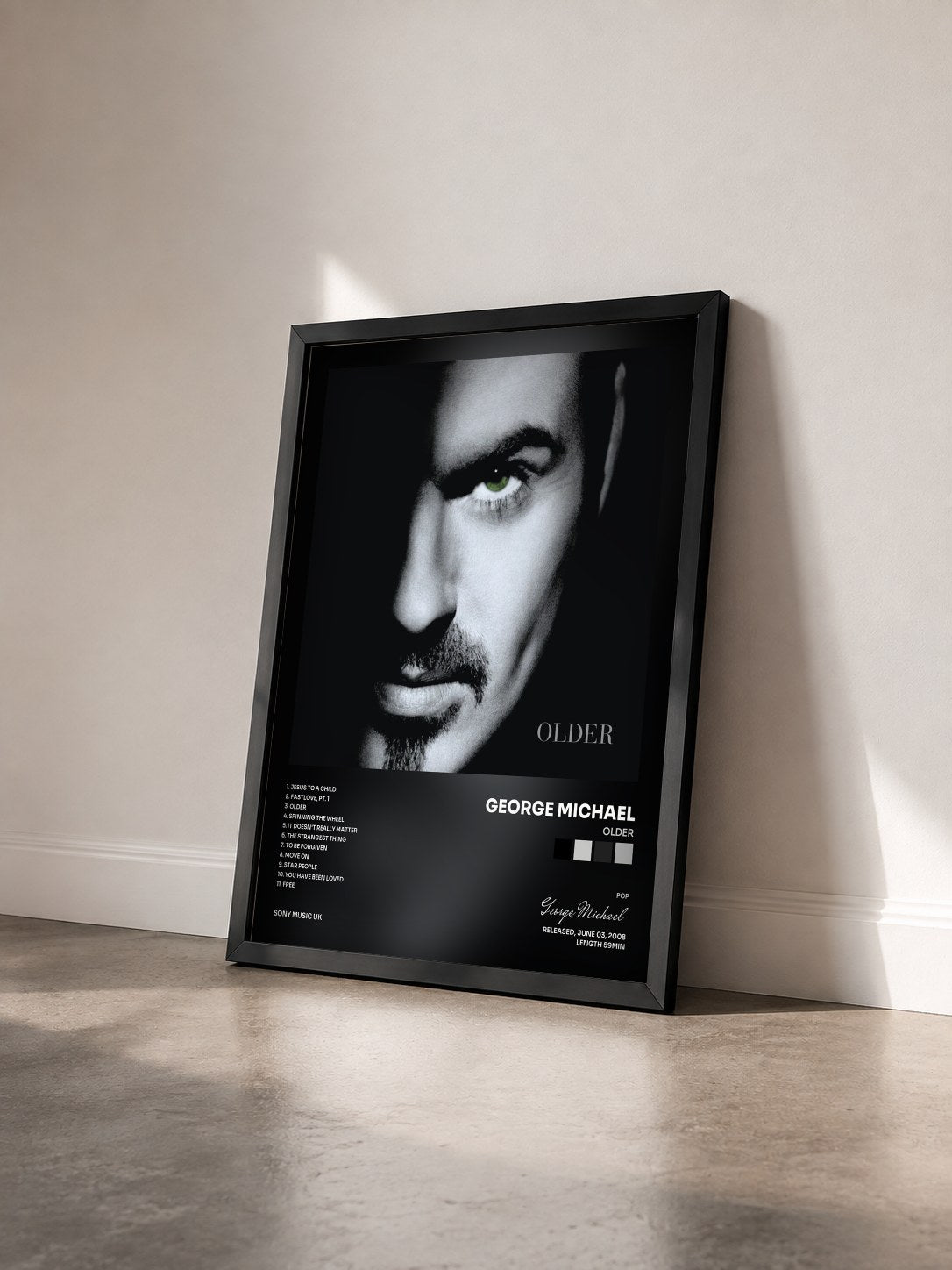 #noir Tableau de l'album Older de George Michael vu de trois quarts, cadre noir