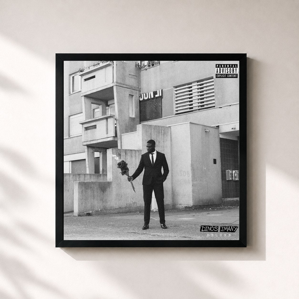 #noir Imany Deluxe by Dinos as a square framed art print, black 32x32 cm frame