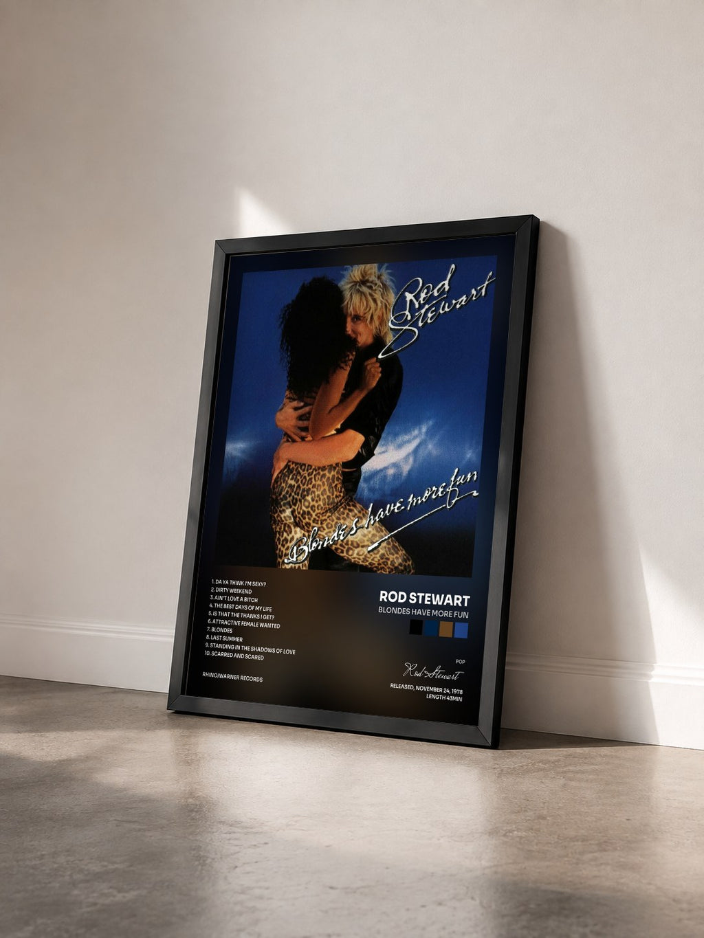 #noir Blondes Have More Fun by Rod Stewart as a framed art print seen at an angle, black frame