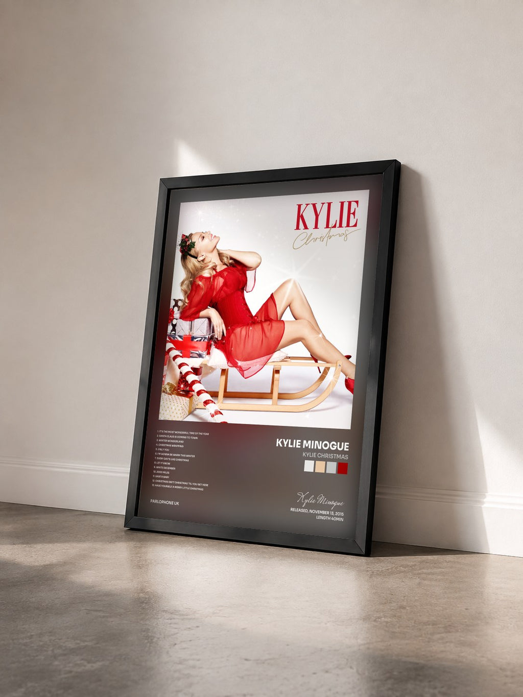 #noir Kylie Christmas by Kylie Minogue as a framed art print seen at an angle, black frame