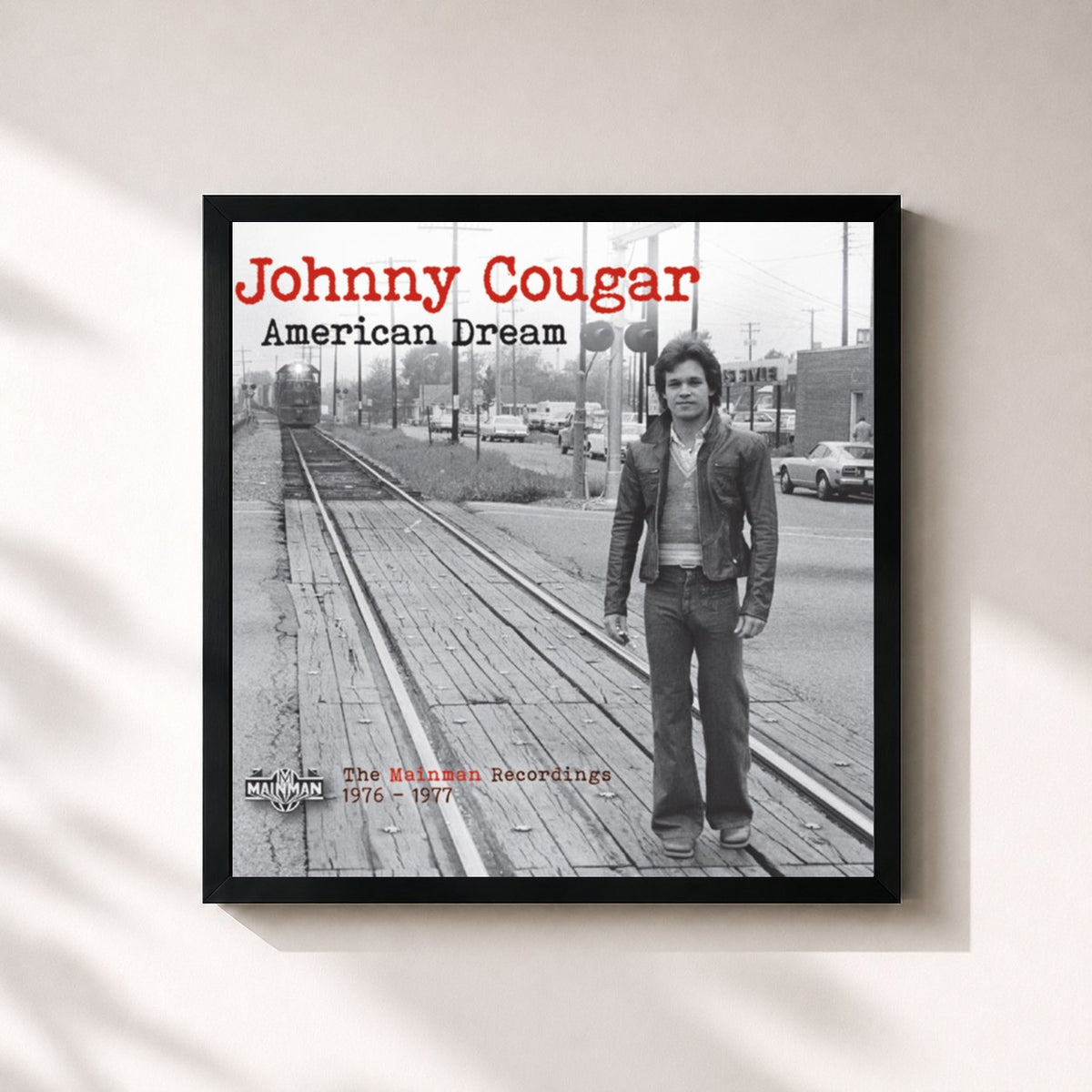 #noir American Dream: The Mainman Recordings 1976-1977 de John Mellencamp en lámina cuadrada enmarcada, marco negro de 32x32 cm