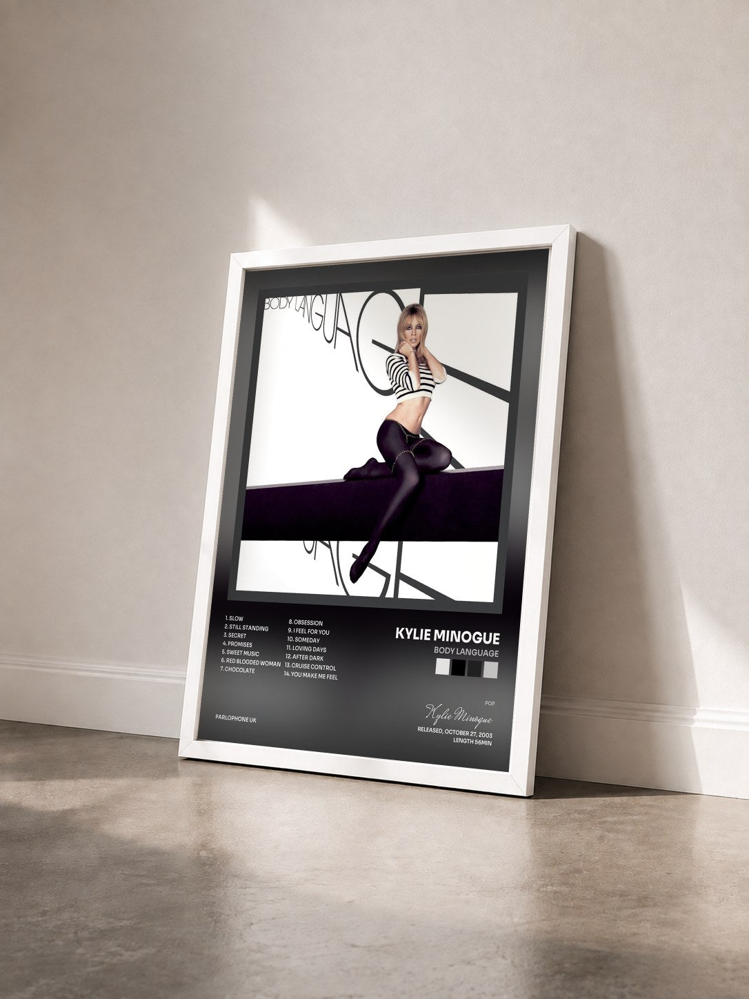 #blanc Tableau de l'album Body Language de Kylie Minogue vu de trois quarts, cadre blanc