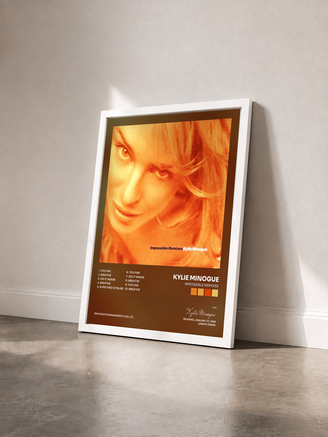 #blanc Tableau de l'album Impossible Remixes de Kylie Minogue vu de trois quarts, cadre blanc