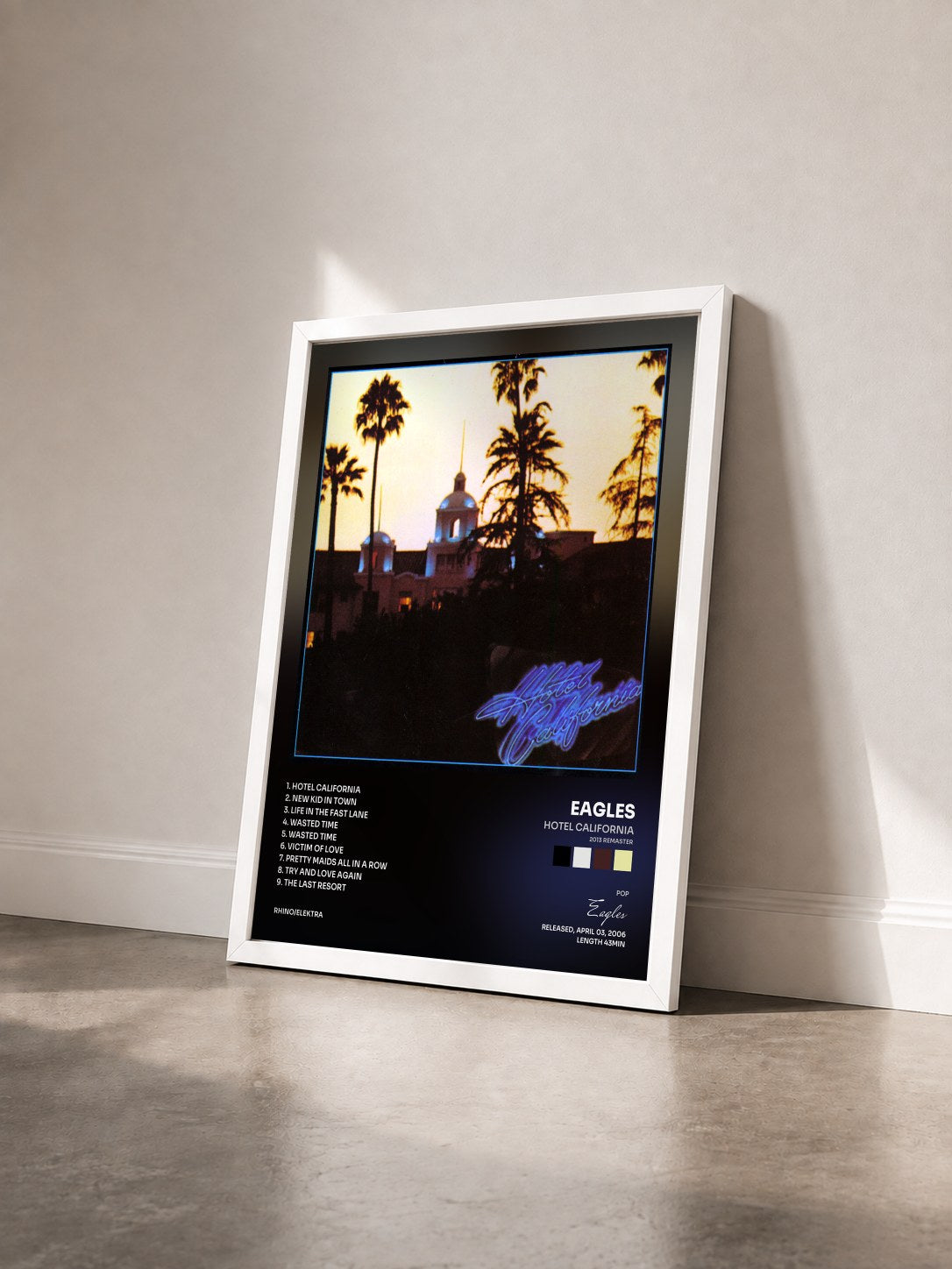 #blanc Hotel California (2013 Remaster) by Eagles as a framed art print seen at an angle, white frame