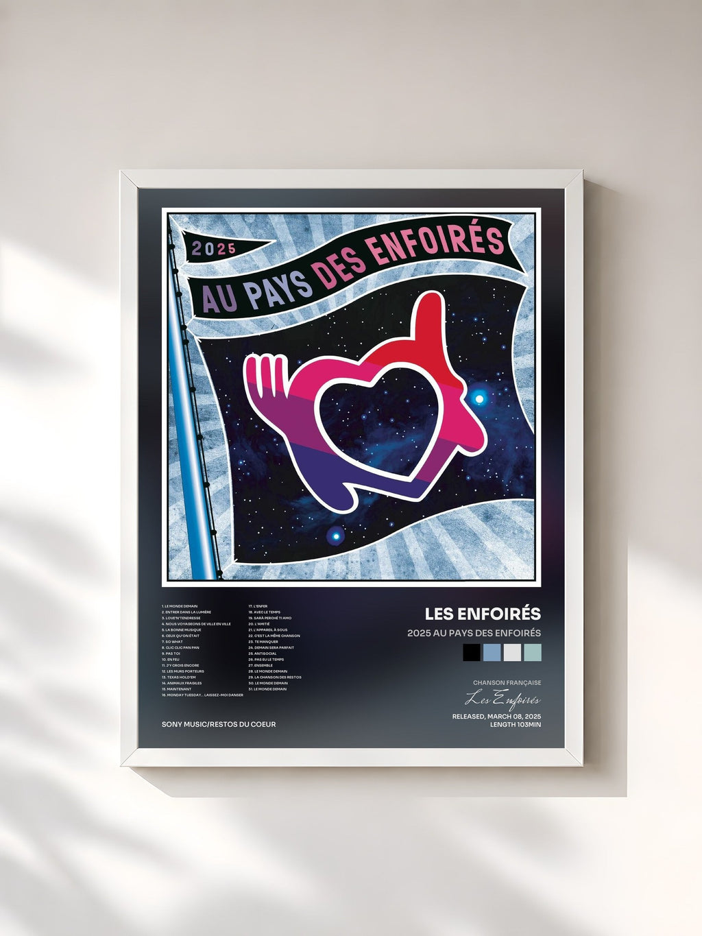 #blanc Tableau de l'album 2025 Au pays des Enfoirés de Les Enfoirés, cadre blanc, imprimé et encadré en France