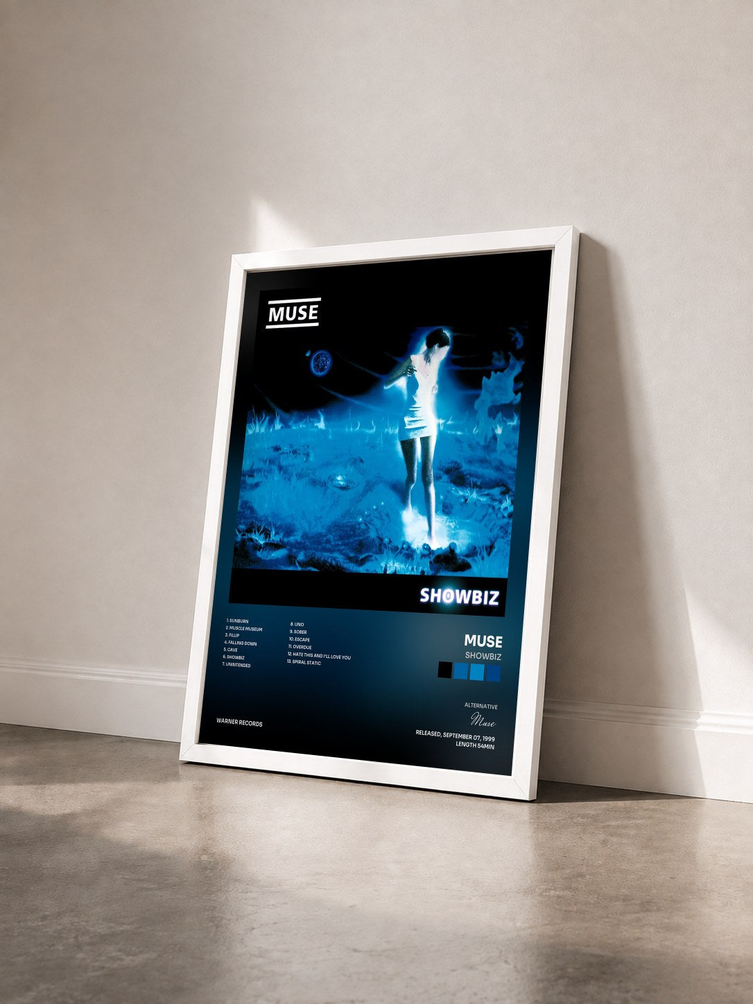 #blanc Tableau de l'album Showbiz de Muse vu de trois quarts, cadre blanc