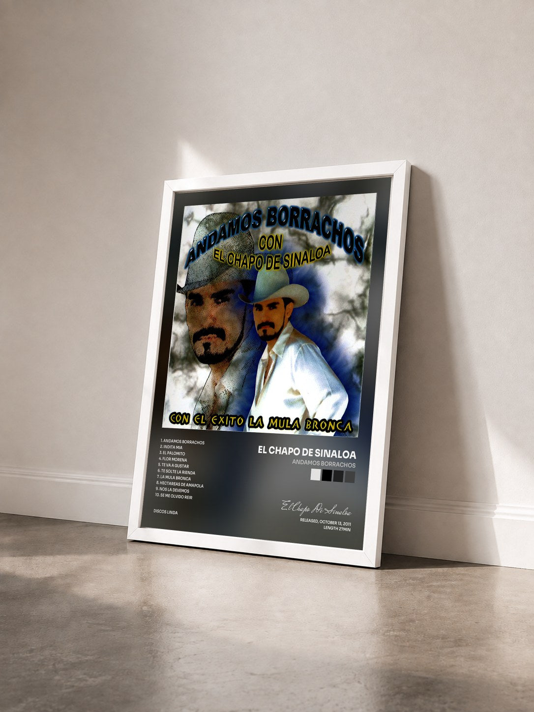 #blanc Tableau de l'album Andamos Borrachos de El Chapo De Sinaloa vu de trois quarts, cadre blanc