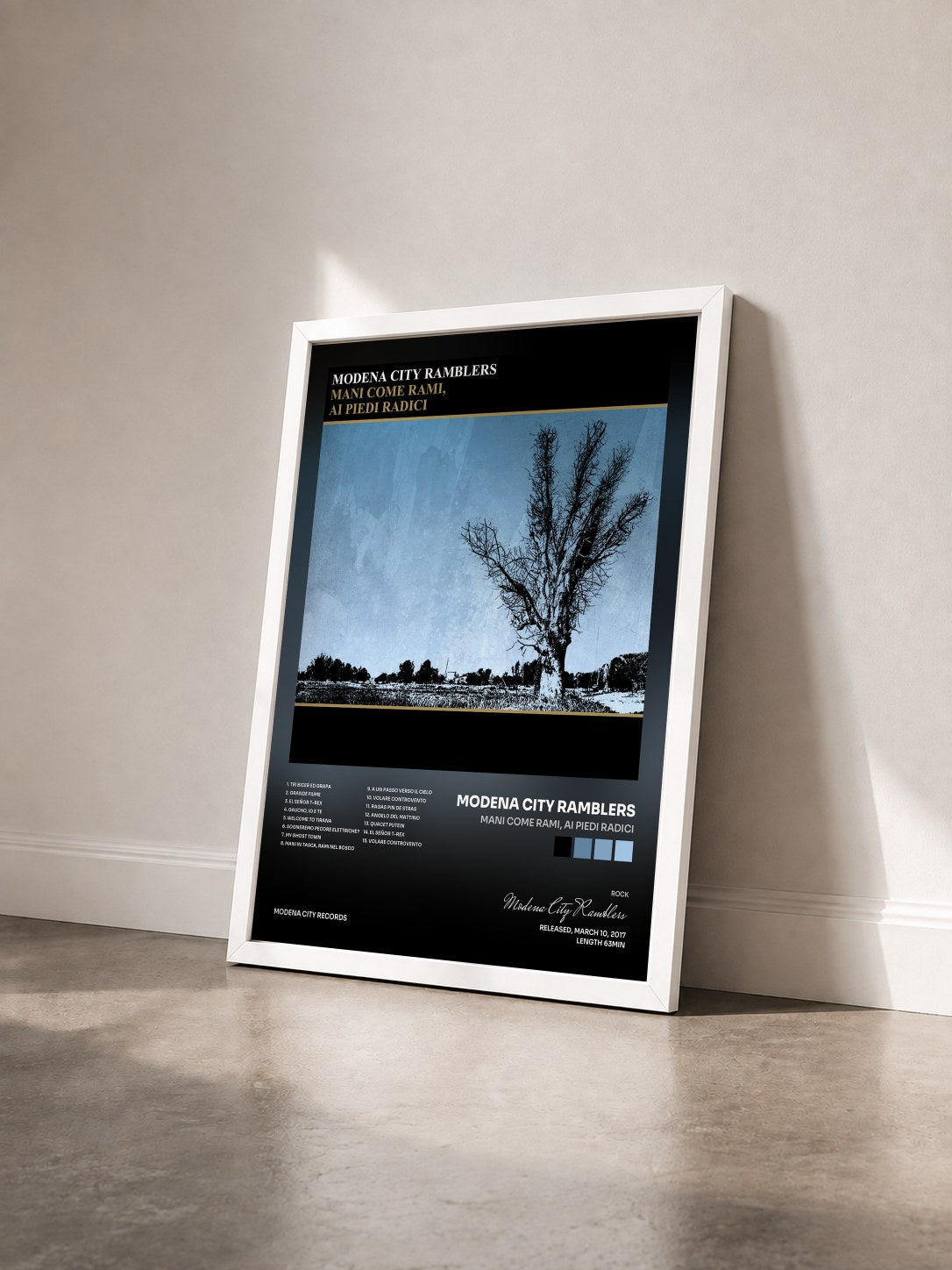 #blanc Tableau de l'album Mani come rami, ai piedi radici de Modena City Ramblers vu de trois quarts, cadre blanc