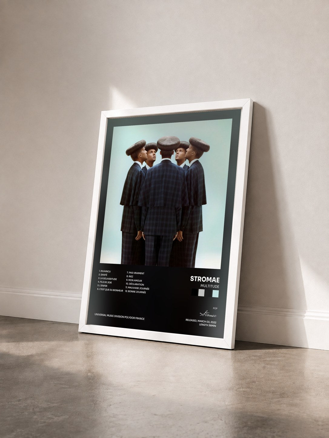 #blanc Multitude by Stromae as a framed art print seen at an angle, white frame