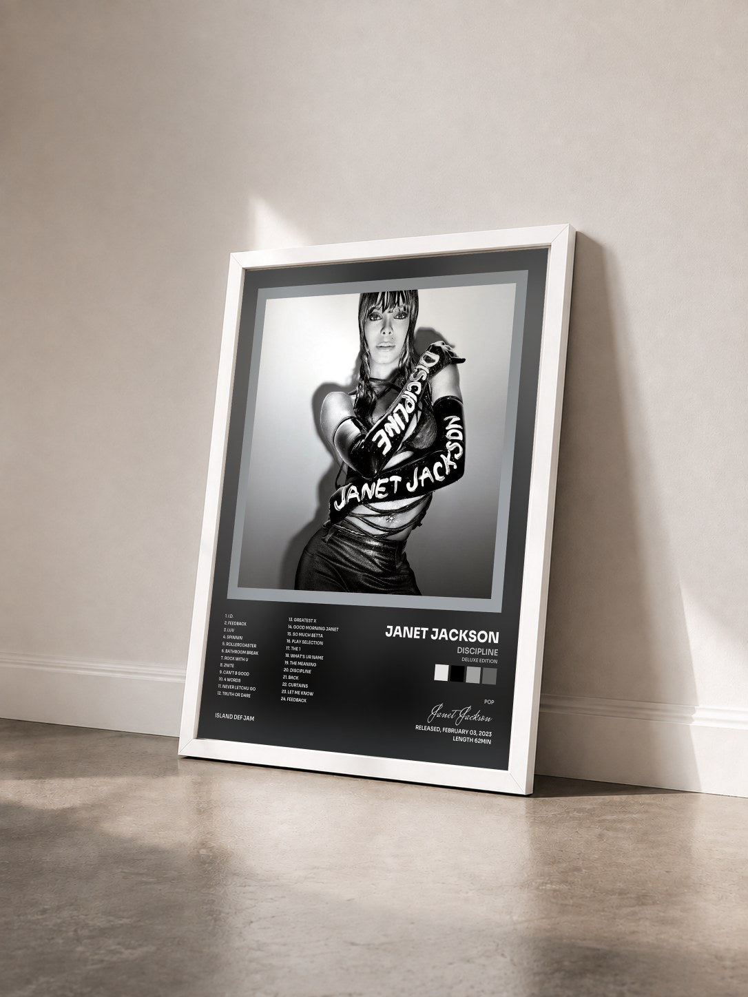 #blanc Tableau de l'album Discipline (Deluxe Edition) de Janet Jackson vu de trois quarts, cadre blanc