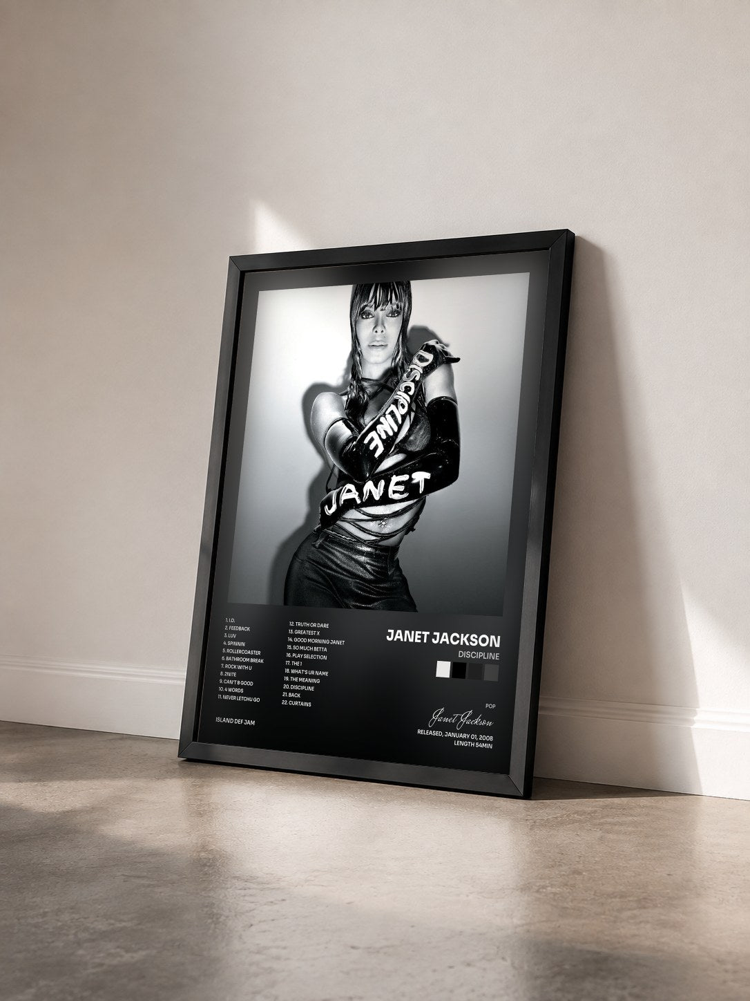 #noir Tableau de l'album Discipline de Janet Jackson vu de trois quarts, cadre noir