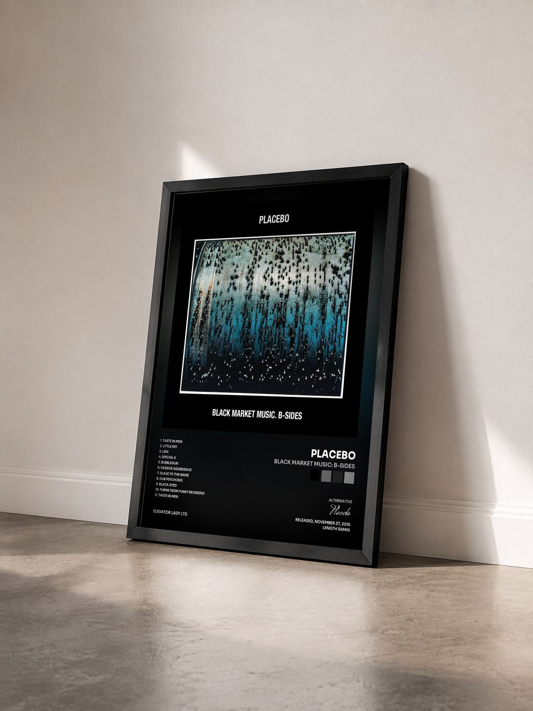 #noir Tableau de l'album Black Market Music: B-Sides de Placebo vu de trois quarts, cadre noir