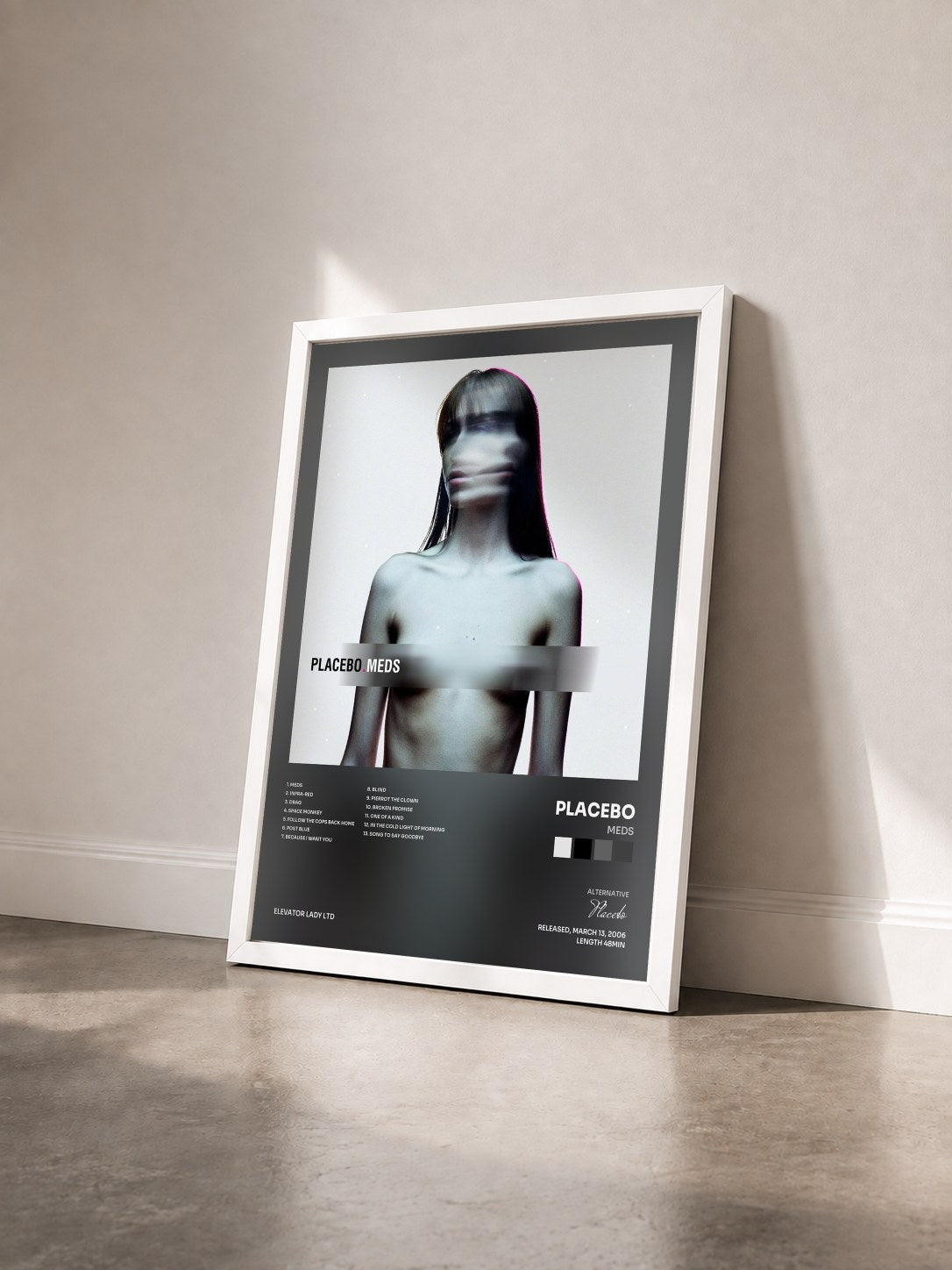 #blanc Tableau de l'album Meds de Placebo vu de trois quarts, cadre blanc