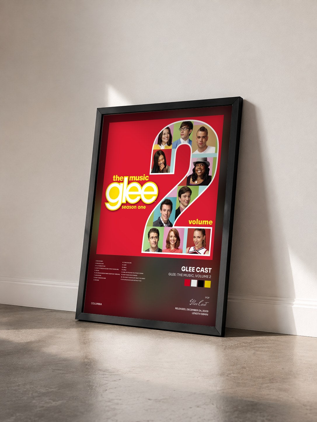 #noir Glee: The Music, Volume 2 by Glee Cast as a framed art print seen at an angle, black frame