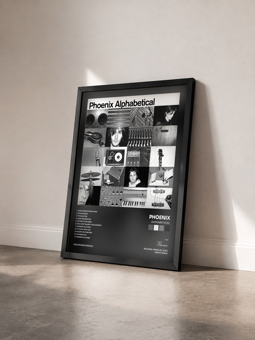 #noir Tableau de l'album Alphabetical de Phoenix vu de trois quarts, cadre noir