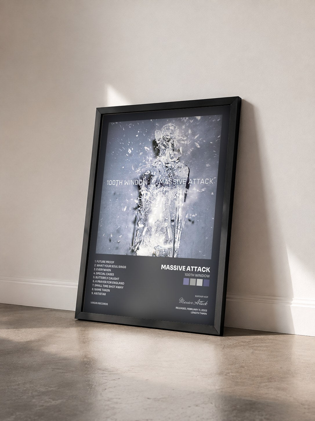 #noir Tableau de l'album 100th Window de Massive Attack vu de trois quarts, cadre noir