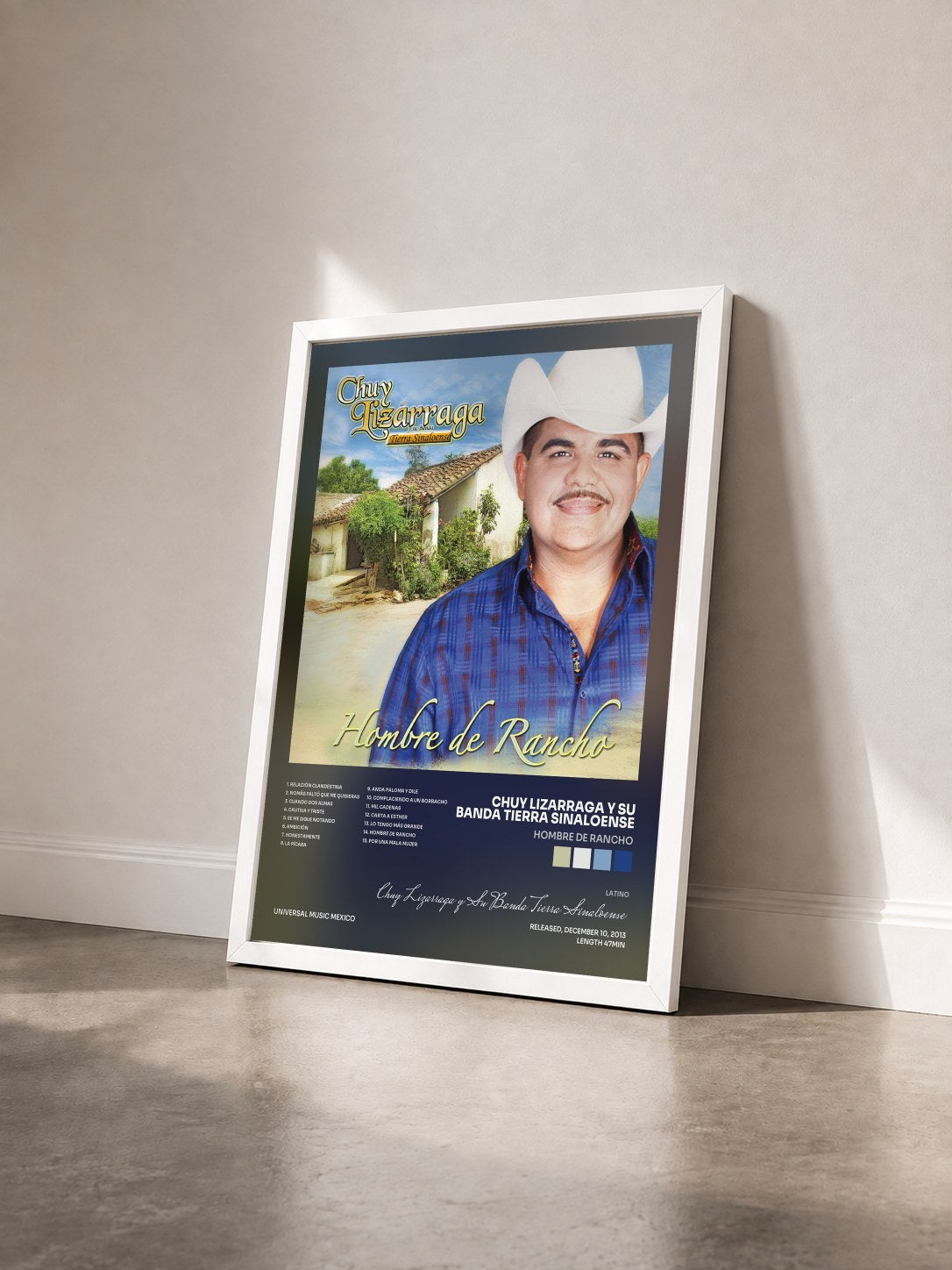 #blanc Tableau de l'album Hombre De Rancho de Chuy Lizarraga y Su Banda Tierra Sinaloense vu de trois quarts, cadre blanc