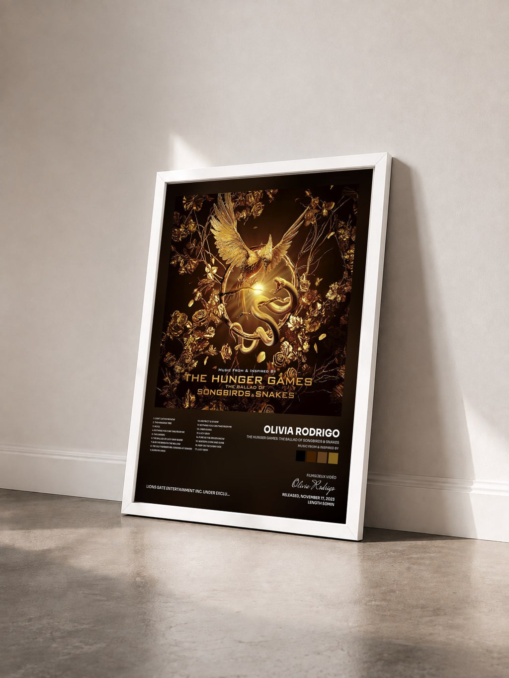#blanc The Hunger Games: The Ballad of Songbirds & Snakes (Music From & Inspired By) by Olivia Rodrigo as a framed art print seen at an angle, white frame