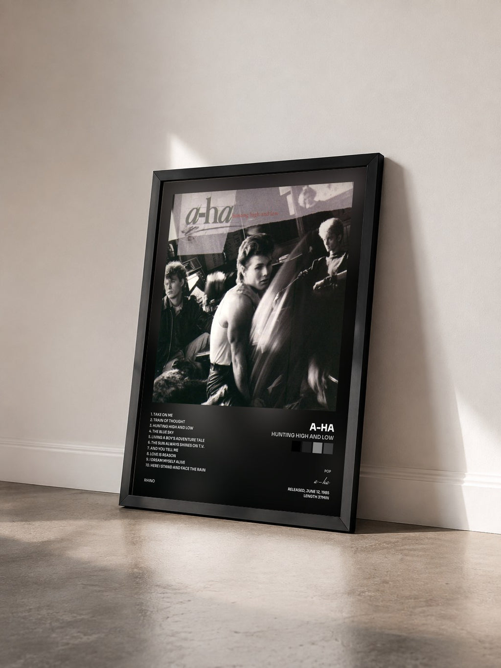 #noir Hunting High and Low by a-ha as a framed art print seen at an angle, black frame