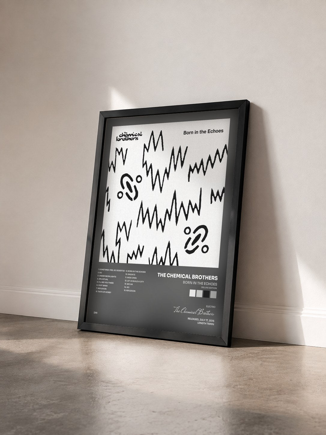 #noir Tableau de l'album Born In The Echoes (Deluxe Edition) de The Chemical Brothers vu de trois quarts, cadre noir