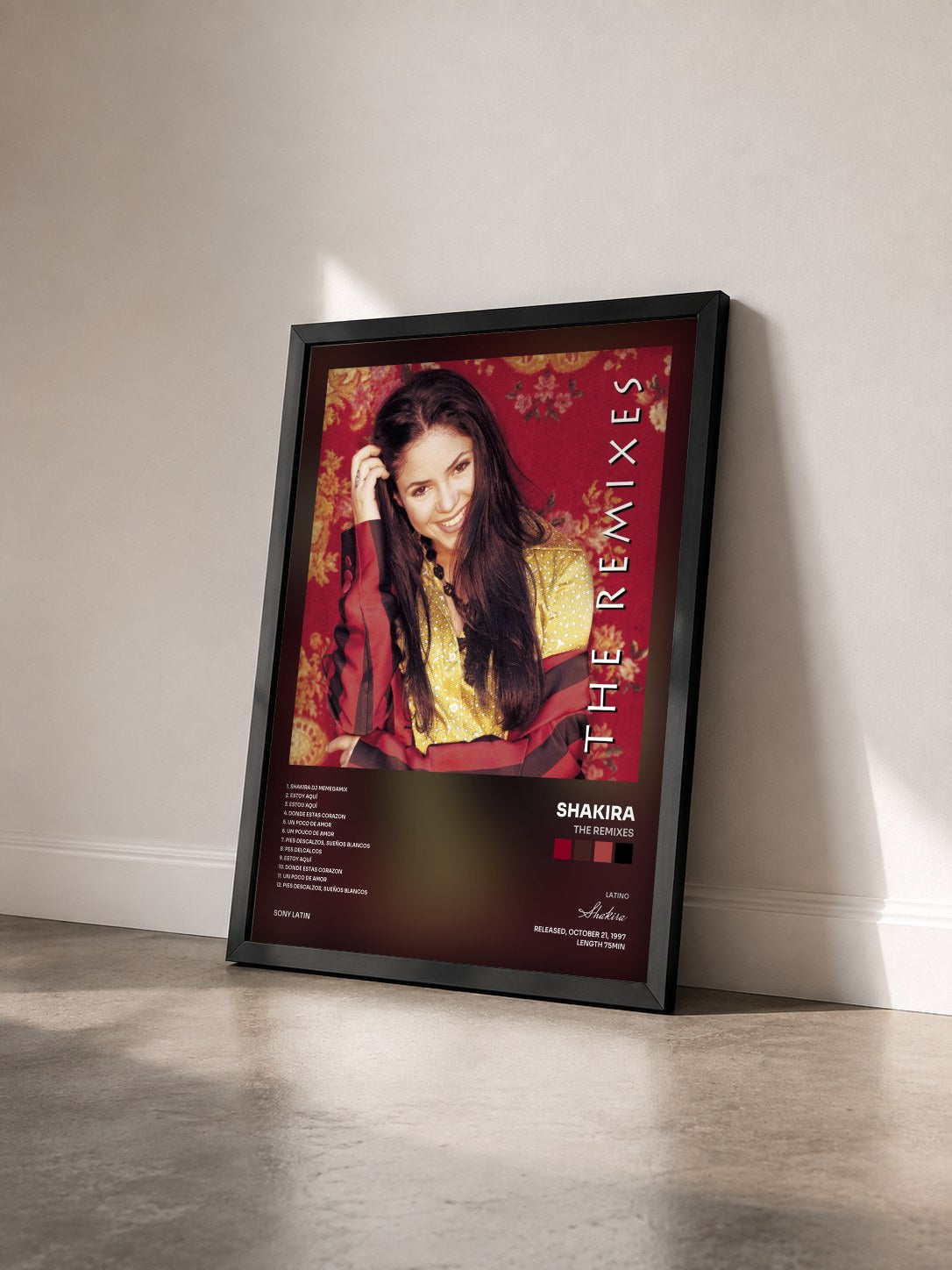 #noir Tableau de l'album The Remixes de Shakira vu de trois quarts, cadre noir