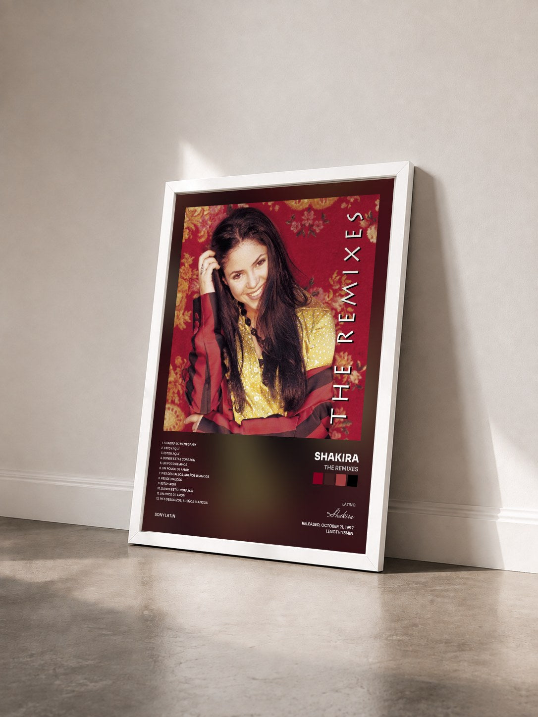 #blanc Tableau de l'album The Remixes de Shakira vu de trois quarts, cadre blanc