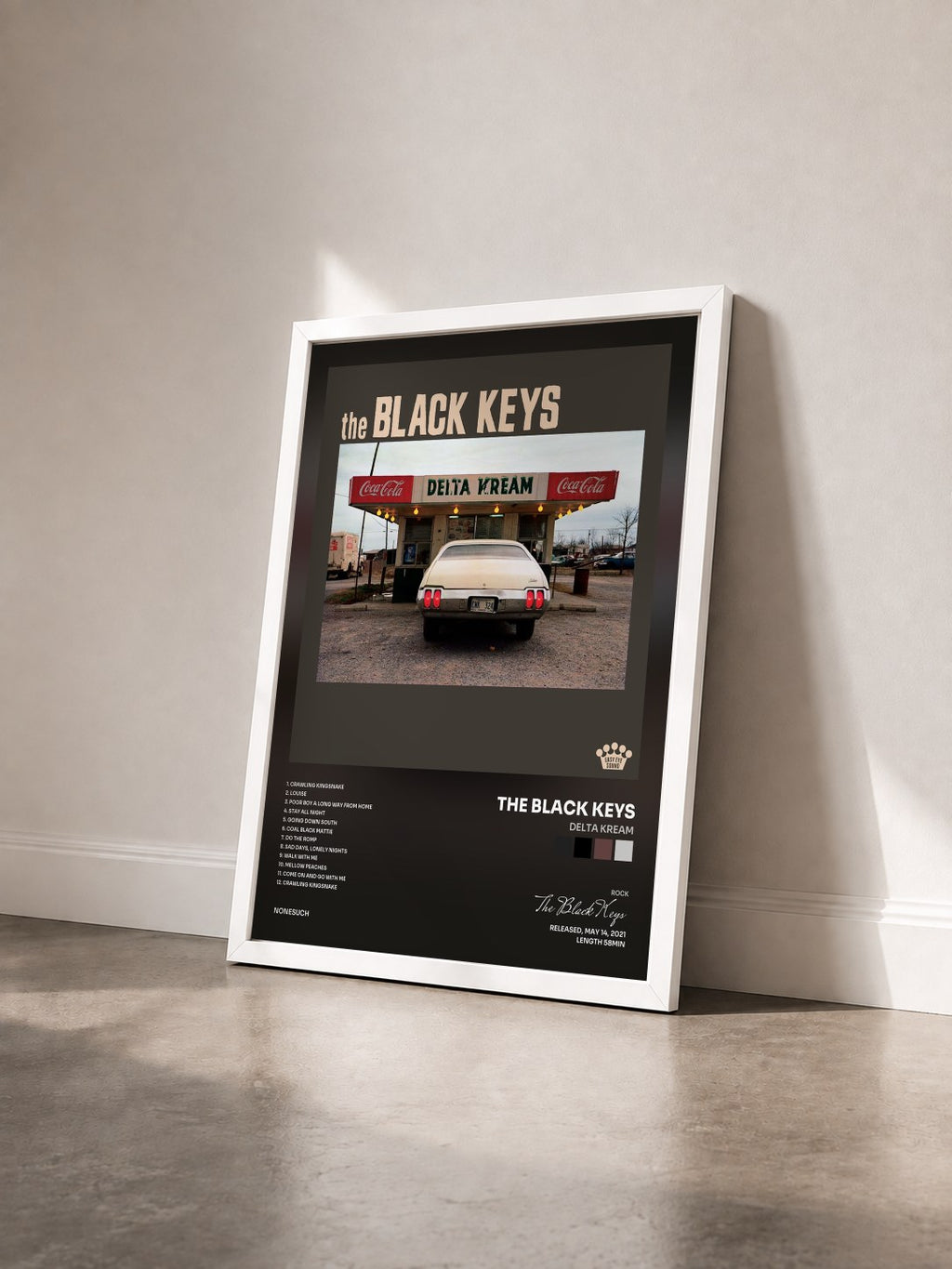 #blanc Delta Kream by The Black Keys as a framed art print seen at an angle, white frame
