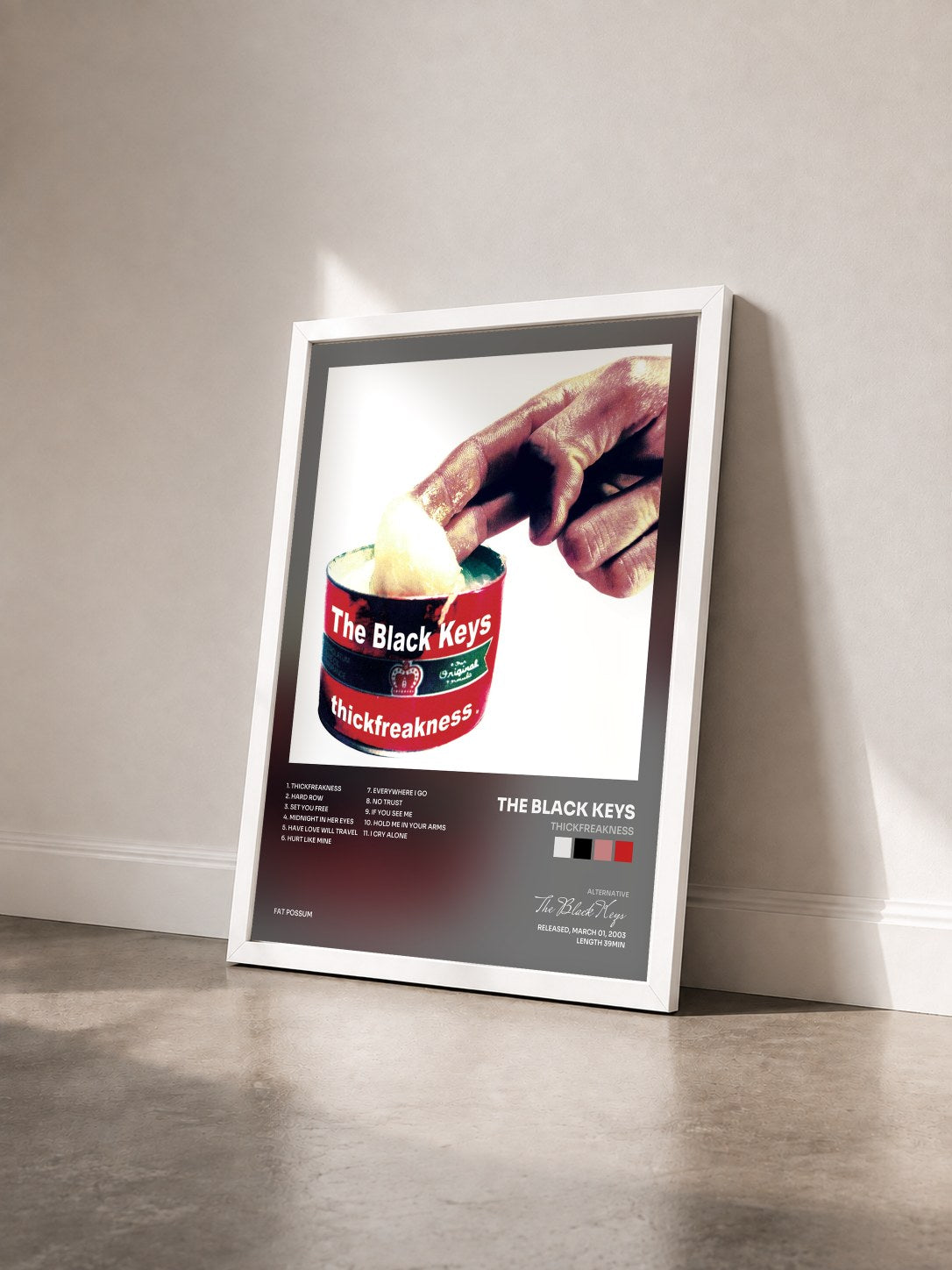 #blanc Tableau de l'album Thickfreakness de The Black Keys vu de trois quarts, cadre blanc