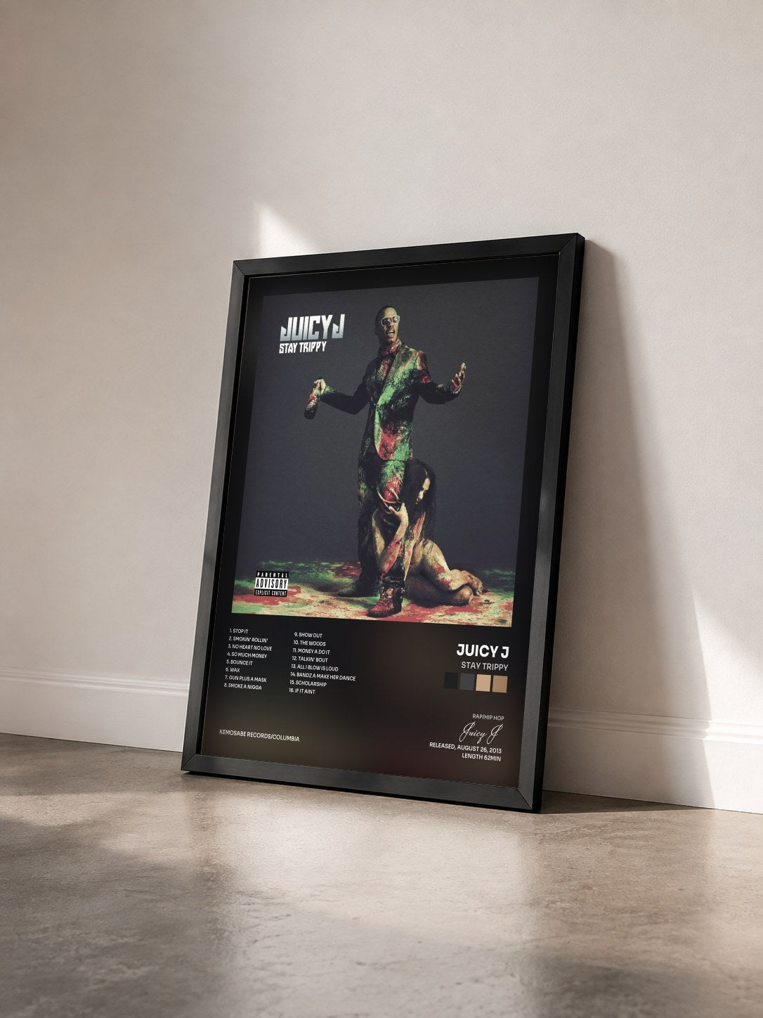 #noir Tableau de l'album Stay Trippy de Juicy J vu de trois quarts, cadre noir