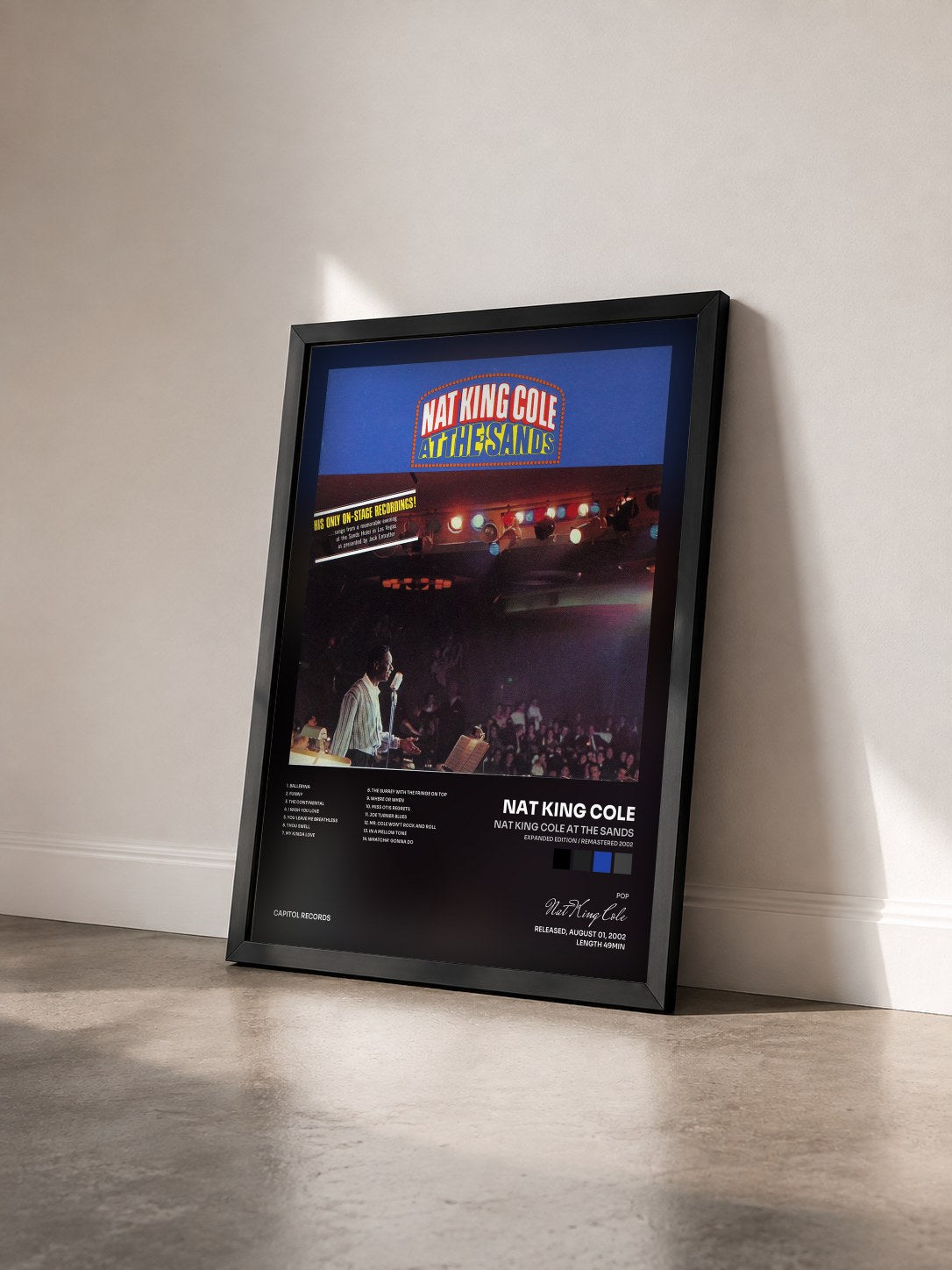 #noir Nat King Cole At The Sands (Expanded Edition / Remastered 2002) by Nat King Cole as a framed art print seen at an angle, black frame
