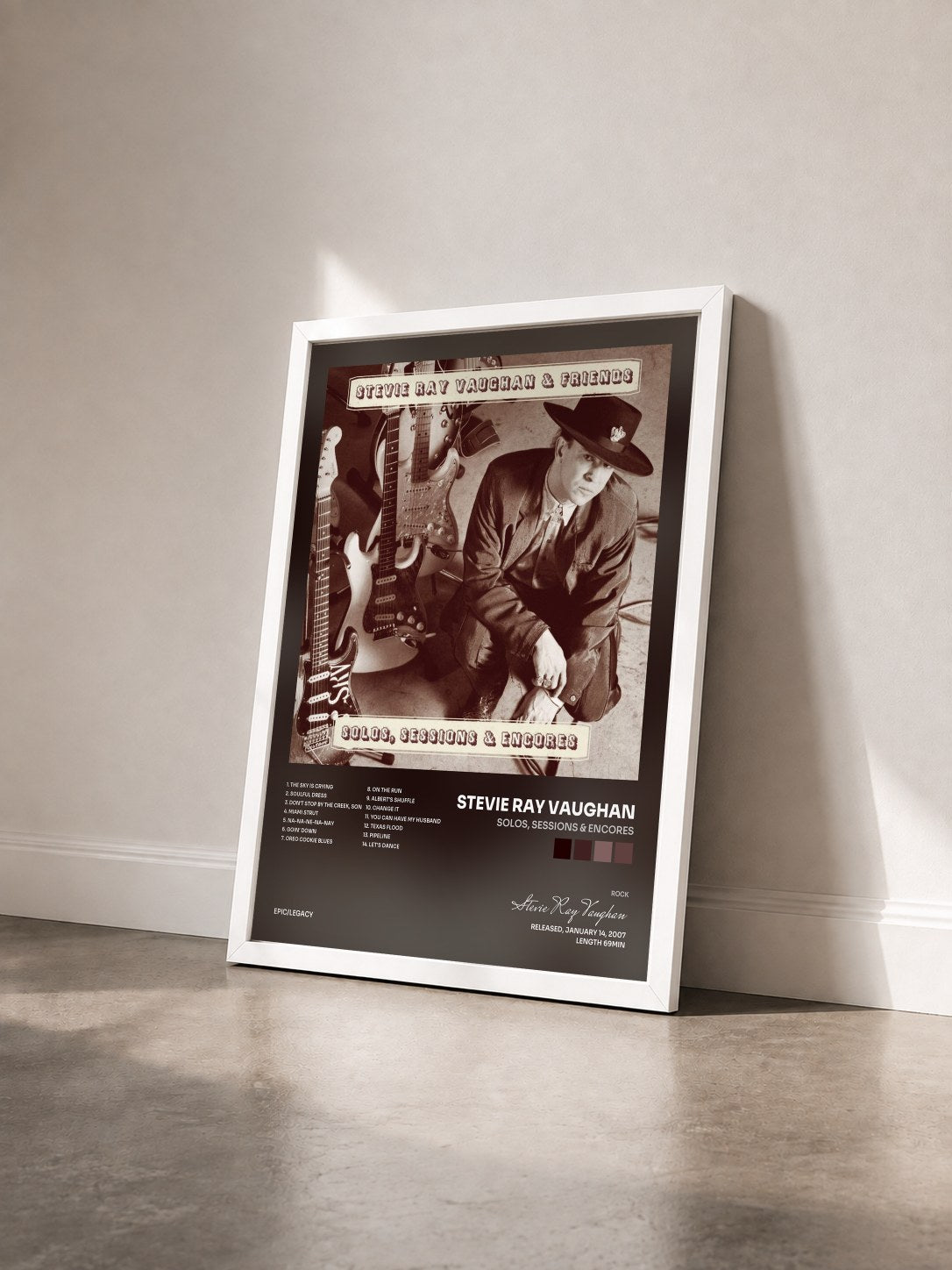 #blanc Solos, Sessions & Encores by Stevie Ray Vaughan as a framed art print seen at an angle, white frame