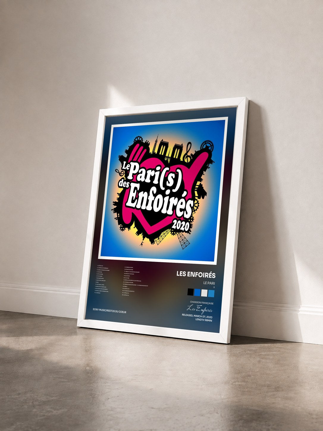 #blanc Tableau de l'album Le Pari(s) des Enfoirés 2020 de Les Enfoirés vu de trois quarts, cadre blanc