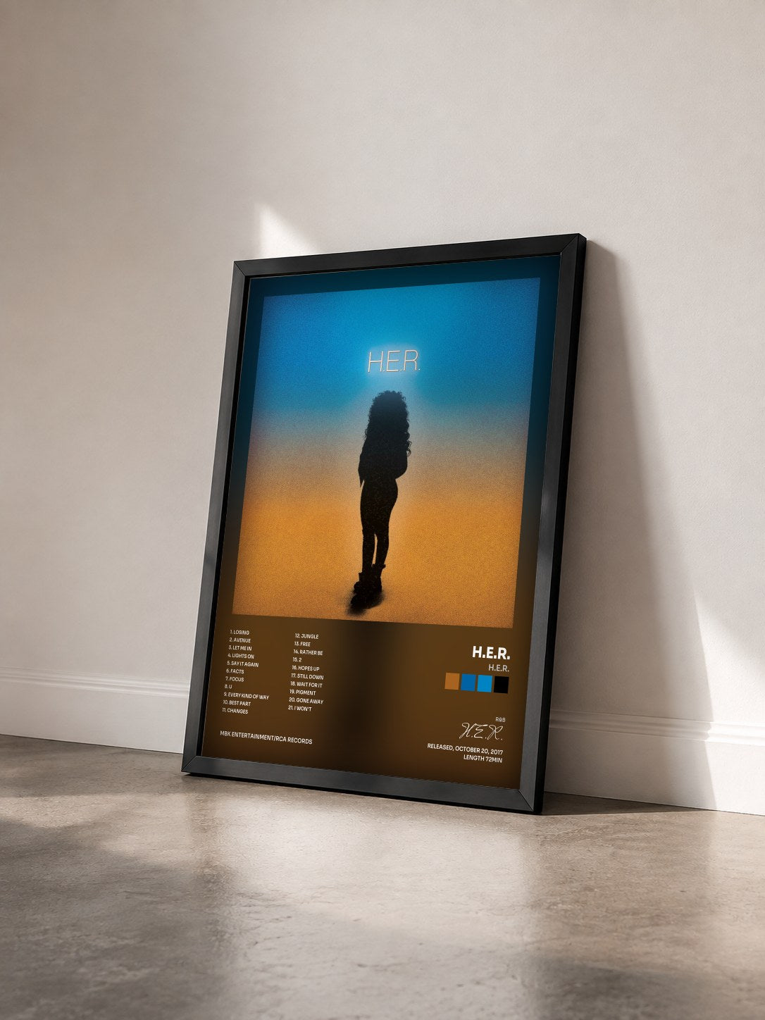#noir H.E.R. by H.E.R. as a framed art print seen at an angle, black frame