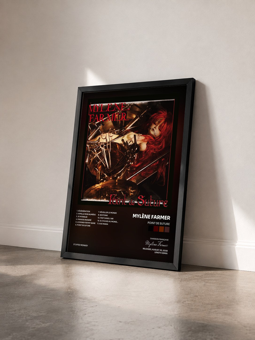 #noir Tableau de l'album Point de suture de Mylène Farmer vu de trois quarts, cadre noir